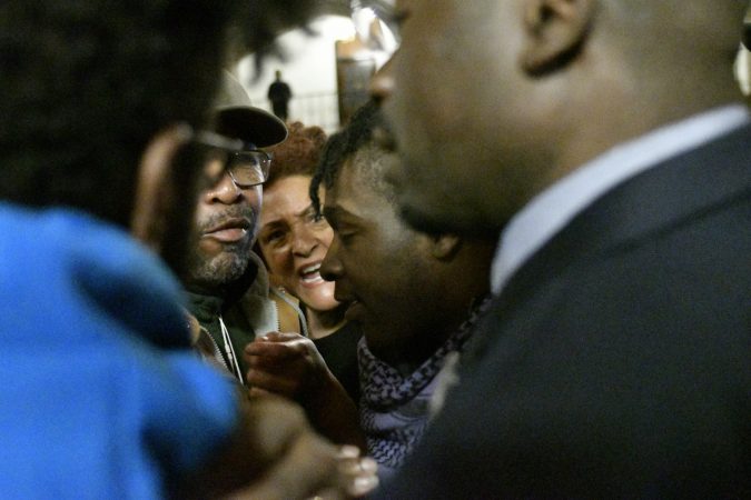 Community members, activist and students shut down a town hall meeting about the proposed $130 million, 35,000 seat stadium on Temple's campus, on Tuesday. (Bastiaan Slabbers/for WHYY)