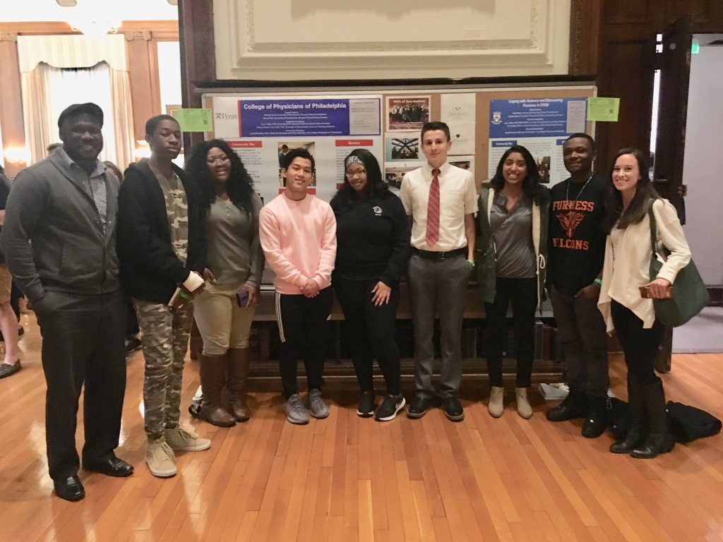 IMG_8802 This year’s College of Physicians Teva interns presenting a poster on gun violence. (Courtesy of Jacqui Bowman)