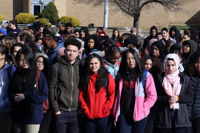Pennsauken High students observe 17 seconds of silence in remembrance of the Parkland school shooting victims. About 600 students, nearly half the school, participated in the walkout.