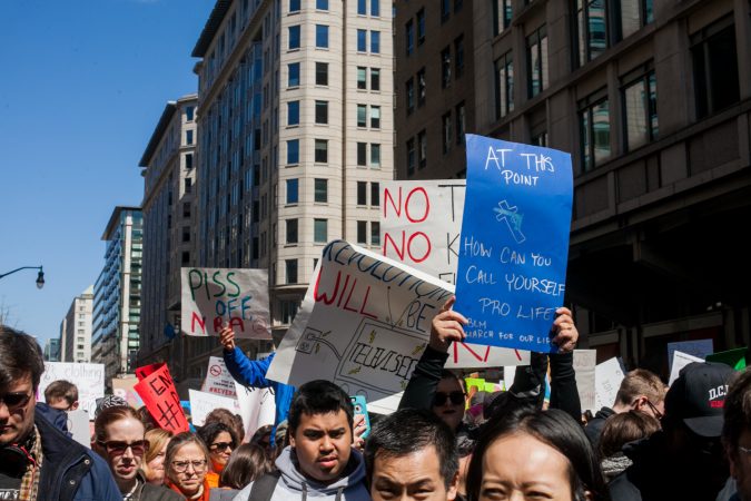 Demonstrators flood 12th Street in downtown Washington D.C during the March for Our Lives Saturday afternoon. (Brad Larrison for WHYY)