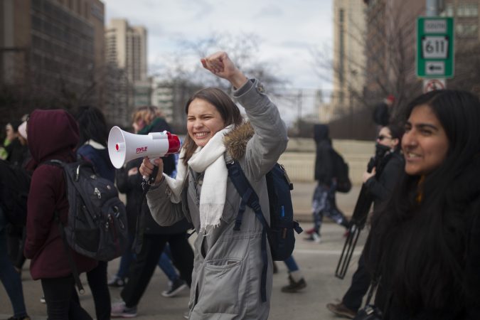 Olivia Sandom, Senior at Julia R. Masterman, leads a crowd of students down North Broad Street