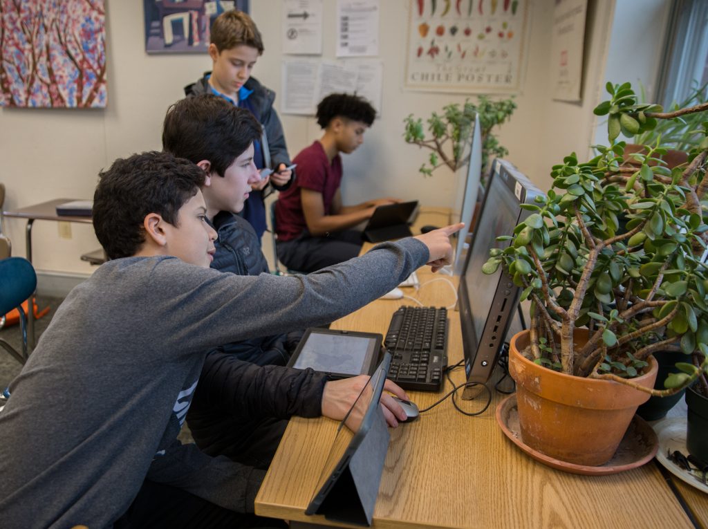 Westtown_school_1800 From left to right: Diego Uribe, Ben Shaman, Jake Richard, and Quinn Berger evalute Pennsylvania's new congressional district map compared to the 2011 version at the Westtown School in West Chester, Pa. (Lindsay Lazarski/WHYY)