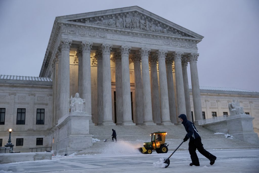Workmen clear snow in front of the U.S. Supreme Court earlier this month. Workmen clear snow in front of the U.S. Supreme Court earlier this month.
(J. Scott Applewhite/AP)