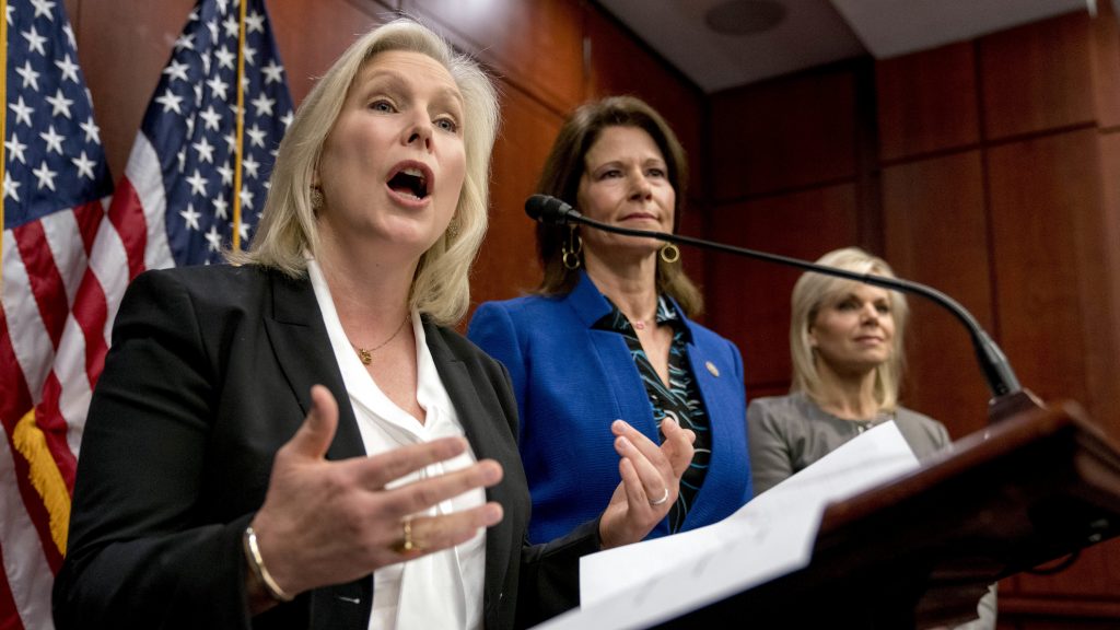 From left, Sen. Kirsten Gillibrand, D-N.Y., accompanied by Rep. Cheri Bustos, D-Ill., and former Fox News host Gretchen Carlson, speaks at a news conference where she and other members of congress introduce legislation to curb sexual harassment in the workplace. Sen. Kirsten Gillibrand, D-N.Y., arrives for a news conference on sexual harassment in the workplace in December on Capitol Hill. (Jacquelyn Martin/AP)