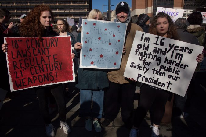 Sophomores from Springfield High School in Springfield, Pa., Kyra Kucirka, 16; Juliana Bater, 15; Ethan Graci, 16; and Deborah Persico, 16; join their peers and fellow citizens as they march for gun control and against gun violence at the Philadelphia March for Our Lives, March 24, 2018. (Emily Cohen for WHYY)