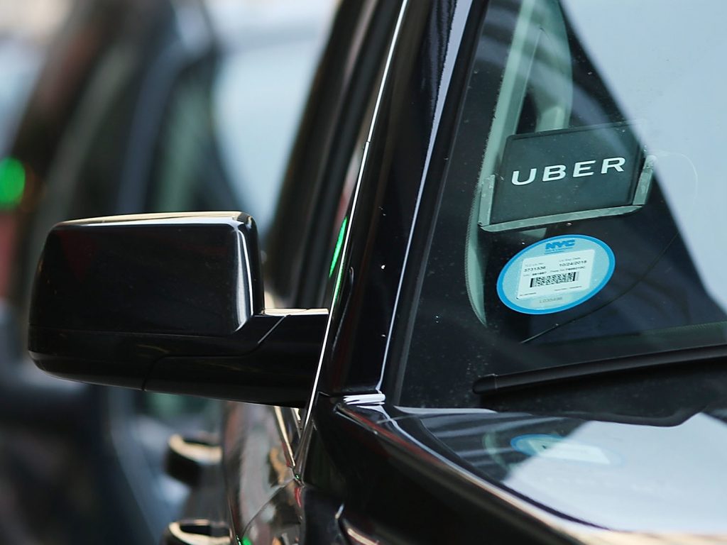An Uber waits for a client in New York City. The company is partnering with health care organizations to provide patients with reliable transportation. An Uber waits for a client in New York City. The company is partnering with health care organizations to provide patients with reliable transportation. (Spencer Platt/Getty Images)