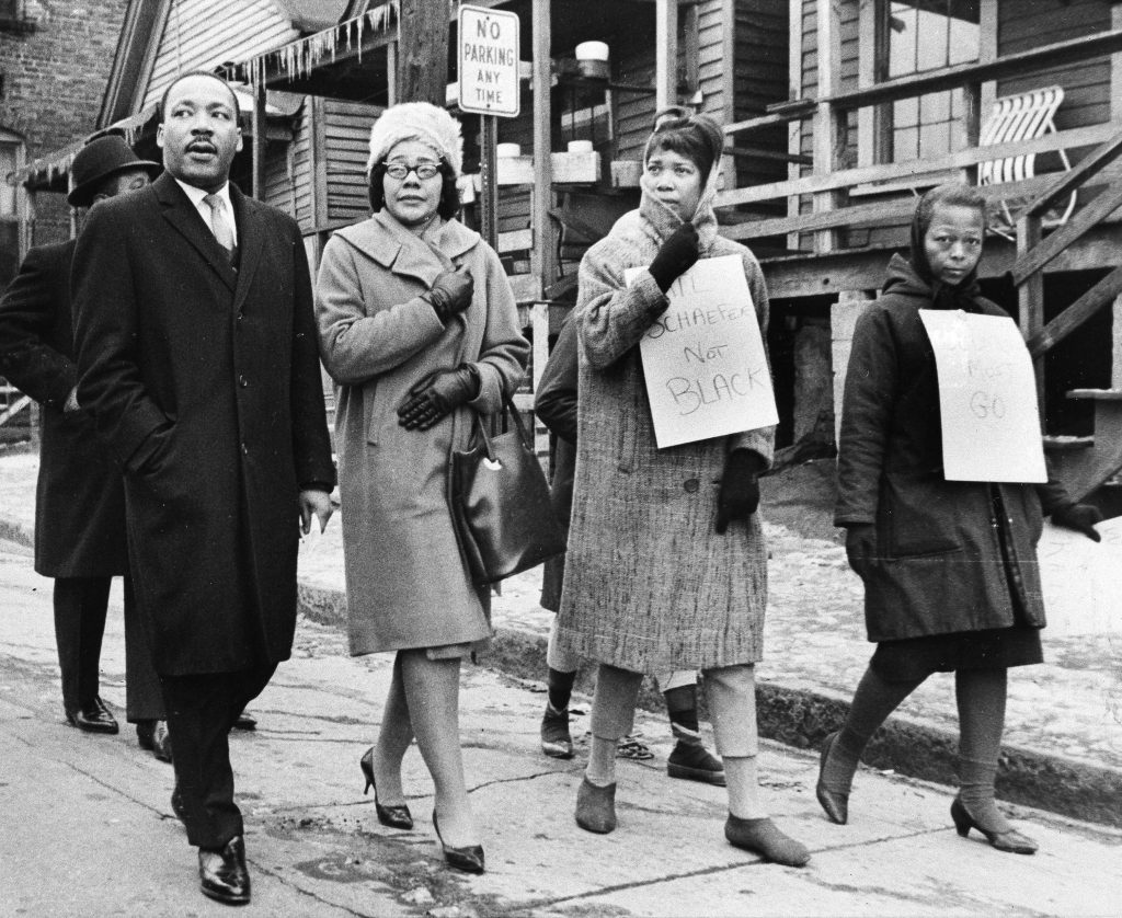 Martin Luther King Dr. Martin Luther King, Jr., left, and his wife, Coretta Scott King, second from left, join pickets during a tour of an Atlanta slum area