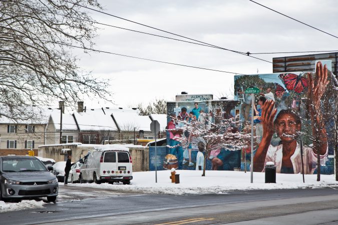 Residents clean up after the snow Thursday morning in West Philadelphia. (Kimberly Paynter/WHYY)