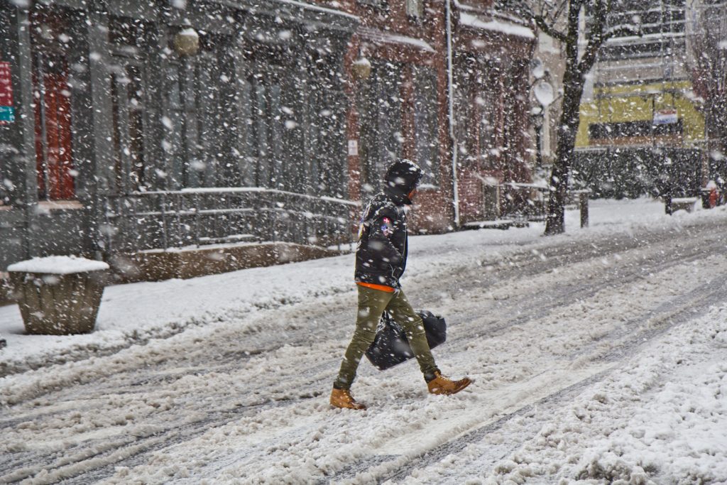 snow people-2 A pedestrian trudges through the storm in Philadelphia Wednesday afternoon. (Kimberly Paynter/WHYY)