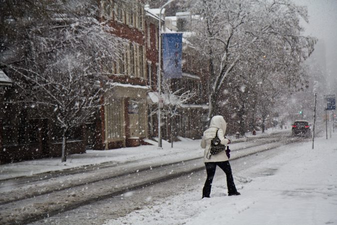 A pedestrian trudges through the storm in Philadelphia Wednesday afternoon. (Kimberly Paynter/WHYY)