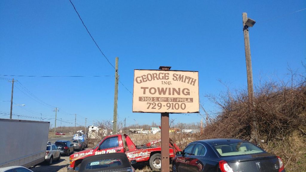 tow Sign outside George Smith Towing in Southwest Philadelphia (Tom MacDonald, WHYY)
