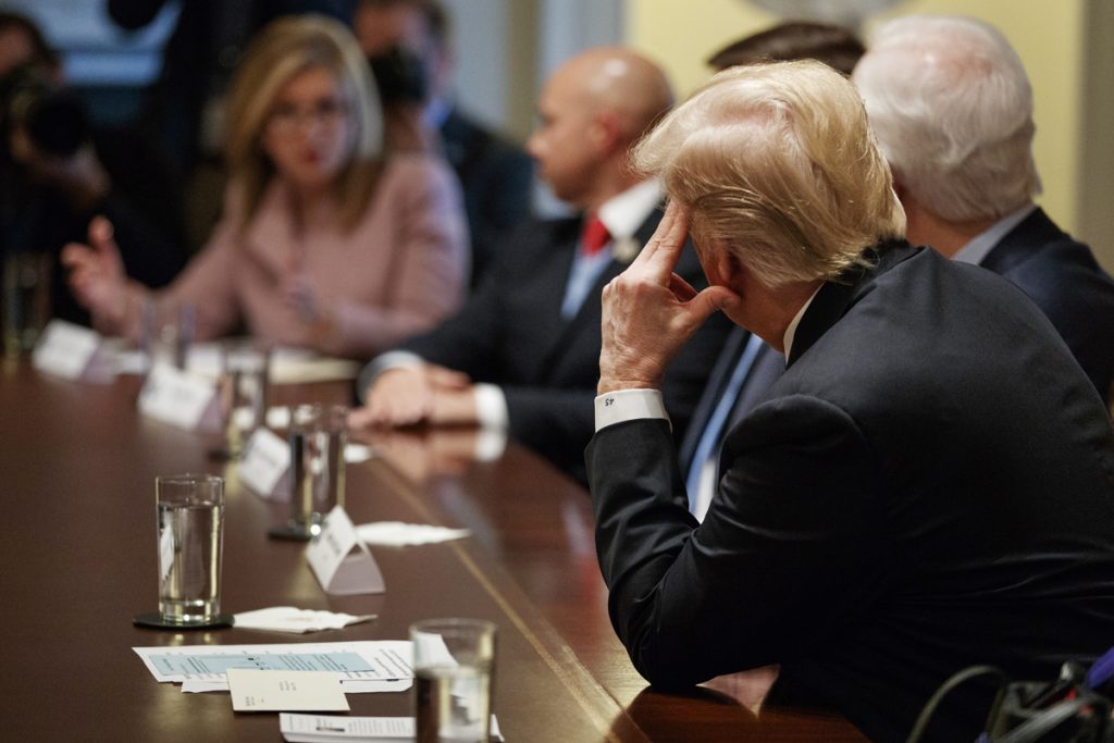 Donald Trump,Marsha Blackburn President Donald Trump looks across the table to Rep. Marsha Blackburn, R-Tenn.