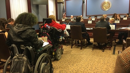 A number of protesters in wheelchairs attended the committee hearing on the bills to create new work requirements and other welfare restrictions. (Katie Meyer/WITF)