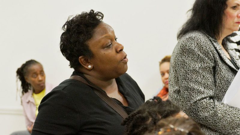 Kendra Brooks, who helped lead a successful charge against a charter conversion proposal at nearby Edward Steel Elementary in 2014, speaks at the Wister community meeting. At Steel, parents voted against Mastery taking over the school. (Bastiaan Slabbers for WHYY)