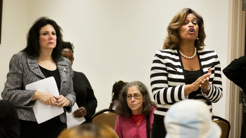 Karen Kolsky (left) and Evelyn Sample-Oates, two top central office staffers from the school district, explained Superintendent Hite's proposal at the 2015 community meeting. (Bastiaan Slabbers for WHYY)