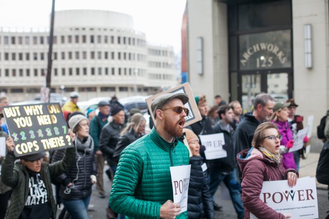 Demonstrators march  toward City Hall in response to an incident last week where two black men were arrested in a Center City Starbucks. (Brad Larrison for WHYY)
