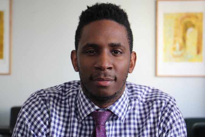 Levi Lee, who grew up in North Philadelphia, is the main clinician for the childhood trauma program at Joseph J. Peters Institute. (Emma Lee/WHYY)