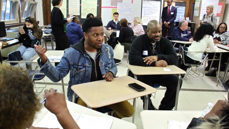 William Fisher, a West Philadelphia father of three, talks about his frustrations with the public school system during a listening session for school board members. (Emma Lee/WHYY)