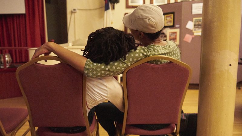 Audience members embrace during recordings of Martin Luther King Jr.'s speeches at Mother Bethel AME Church. (Natalie Piserchio for WHYY)