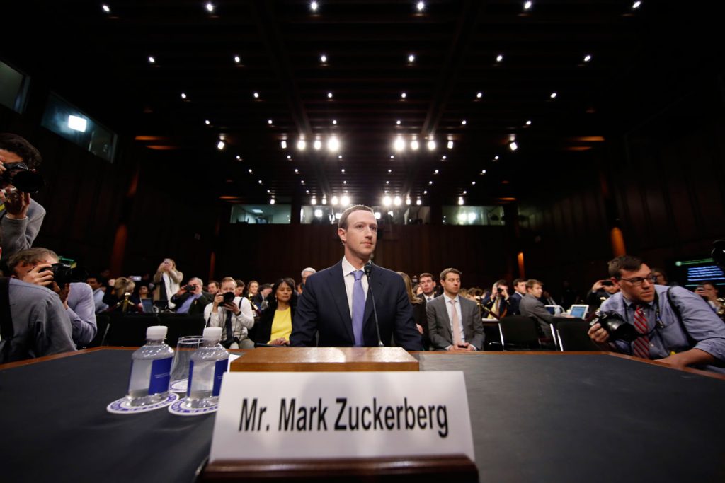 20180410-zuckerberg-facebook-testimony Facebook CEO Mark Zuckerberg takes his seat after a break to continue to testify before a joint hearing of the Commerce and Judiciary Committees on Capitol Hill in Washington, Tuesday, April 10, 2018, about the use of Facebook data to target American voters in the 2016 election. (AP Photo/Alex Brandon)