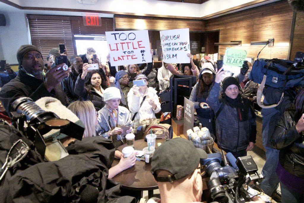 20180415_Starbucks_Protest_BS1419_007__BAS3949 People gather at a Starbucks on 18th and Spruce streets in Philadelphia to protest Thursday's controversial arrests of two black men at the store. (Bastiaan Slabbers/for WHYY)