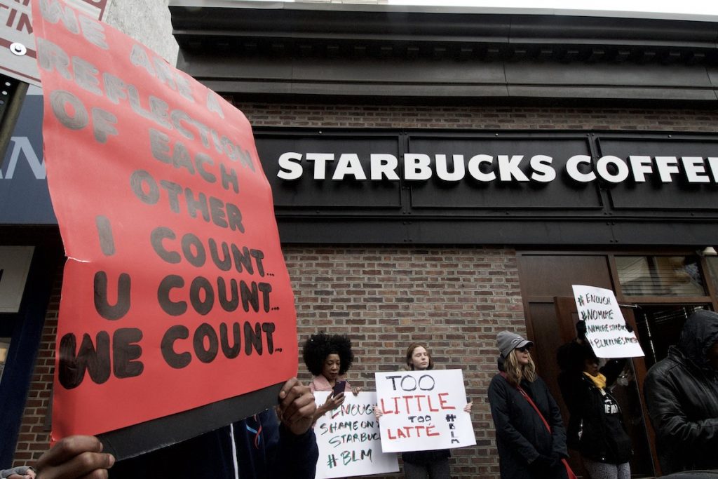 20180415_Starbucks_Protest_BS1419_011__BAS4021 People gather outside a Starbucks on 18th and Spruce streets in Philadelphia to protest Thursday's controversial arrests of two black men at the store. (Bastiaan Slabbers/for WHYY)