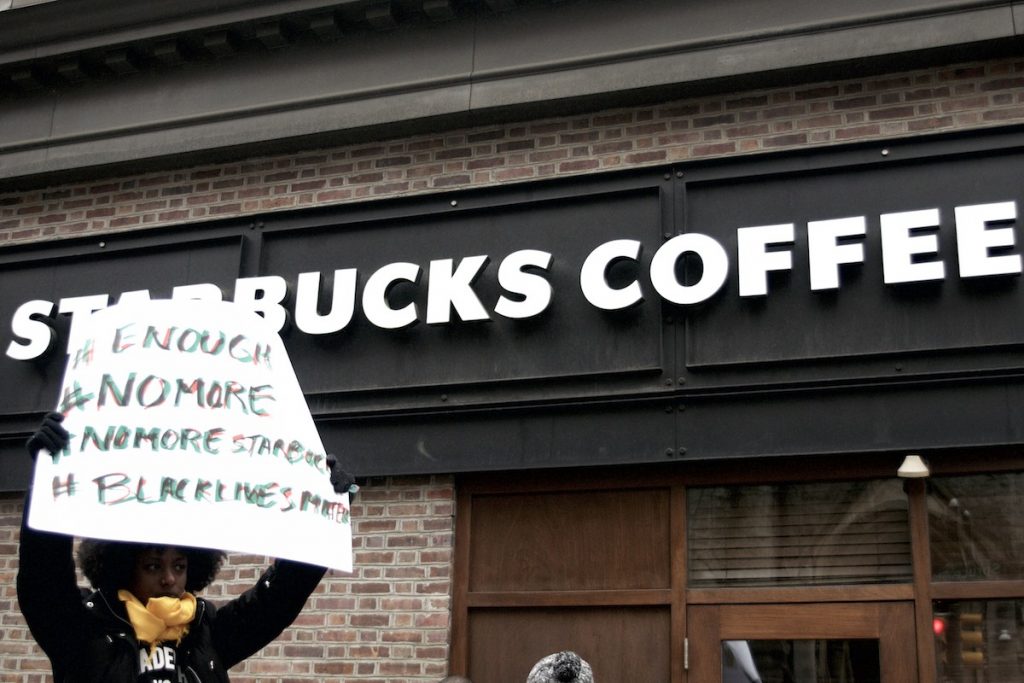 20180415_Starbucks_Protest_BS1419_012__BS28457 People gather outside a Starbucks on 18th and Spruce streets in Philadelphia to protest Thursday's controversial arrests of two black men at the store. (Bastiaan Slabbers/for WHYY)