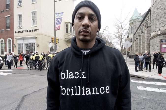 Edwin Santana is one of the people who gathered outside a Starbucks on 18th and Spruce streets in Philadelphia to protest Thursday's controversial arrests of two black men. (Bastiaan Slabbers/for WHYY)