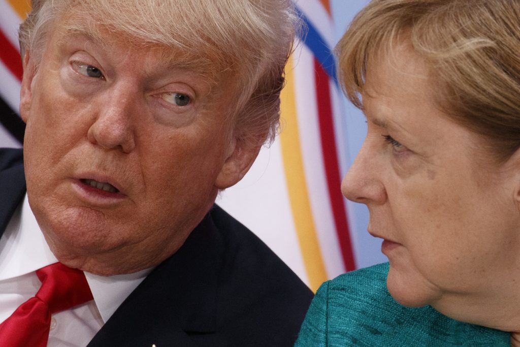 President Donald Trump, left, talks with German Chancellor Angela Merkel during the Women's Entrepreneurship Finance event at the G20 Summit, Saturday, July 8, 2017, in Hamburg. (AP Photo/Evan Vucci)