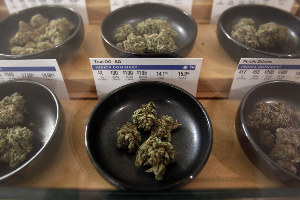 California Marijuana-Open for Business Different types of marijuana sit on display at Harborside marijuana dispensary, Monday, Jan. 1, 2018, in Oakland, Calif. Starting New Year's Day, recreational marijuana can be sold legally in California. (Mathew Sumner/AP Photo)