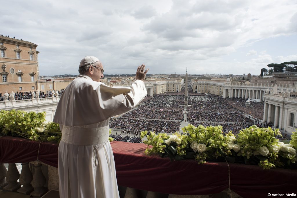 Vatican Pope Easter Pope Francis delivers the Urbi et Orbi (to the city and to the world) blessing at the end of the Easter Sunday Mass in St. Peter's Square at the Vatican, Sunday, April 1, 2018. (Vatican Media via AP)