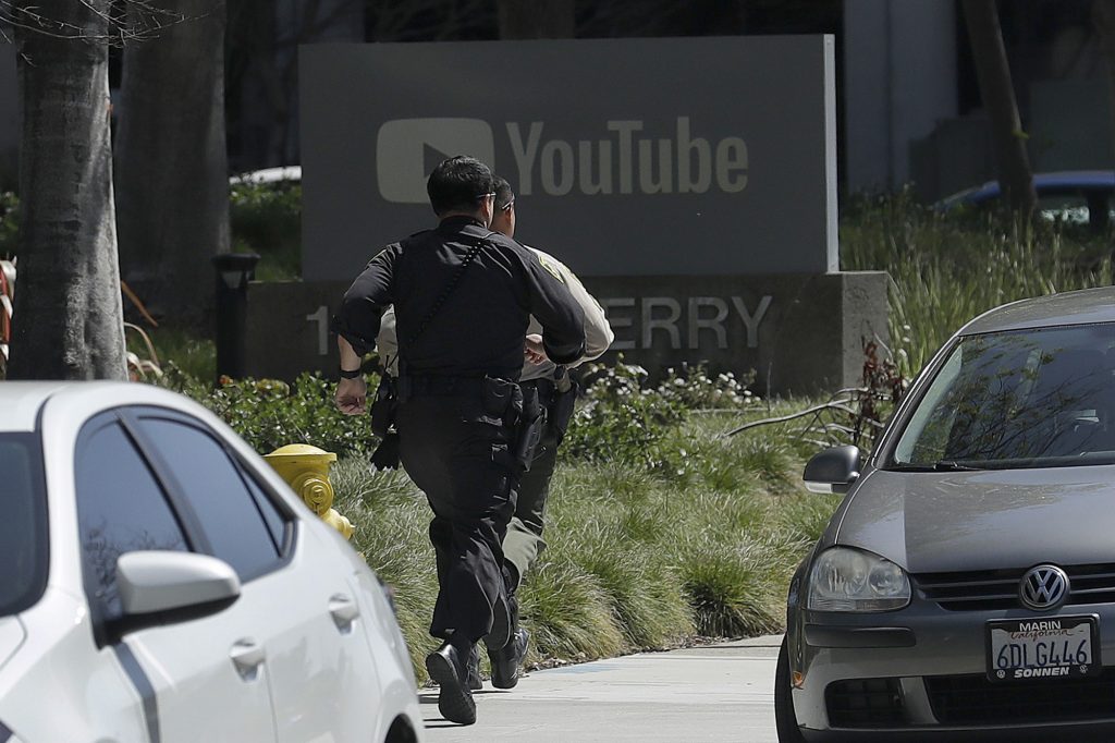 Youtube Shooting Officers run toward a YouTube office in San Bruno, Calif., Tuesday, April 3, 2018. Police say they’re responding to an active shooter at YouTube headquarters.