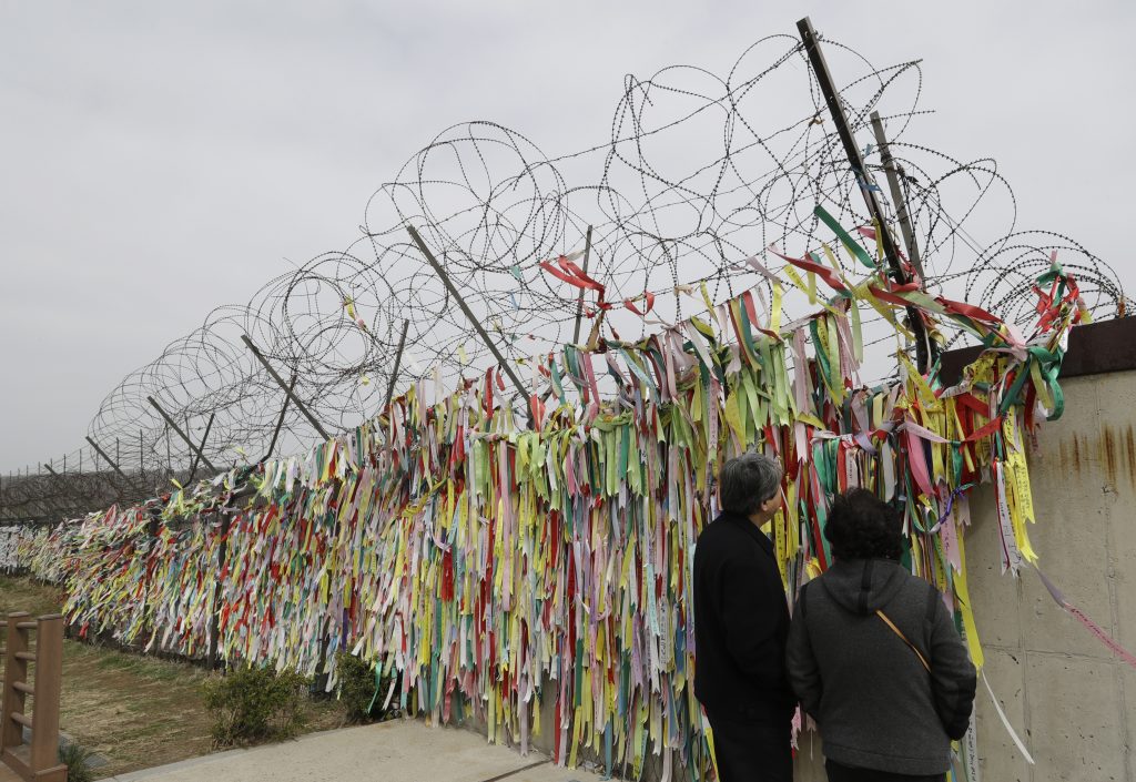 South Korea Koreas Tensions Visitors look at the ribbons carrying messages wishing the reunification and peace of the two Koreas at the Imjingak Pavilion in Paju, South Korea, Saturday, April 7, 2018. North and South Korea have held talks over establishing a telephone hotline between their leaders and other communication issues ahead of a rare summit between the rivals later this month. (Lee Jin-man/AP Photo)
