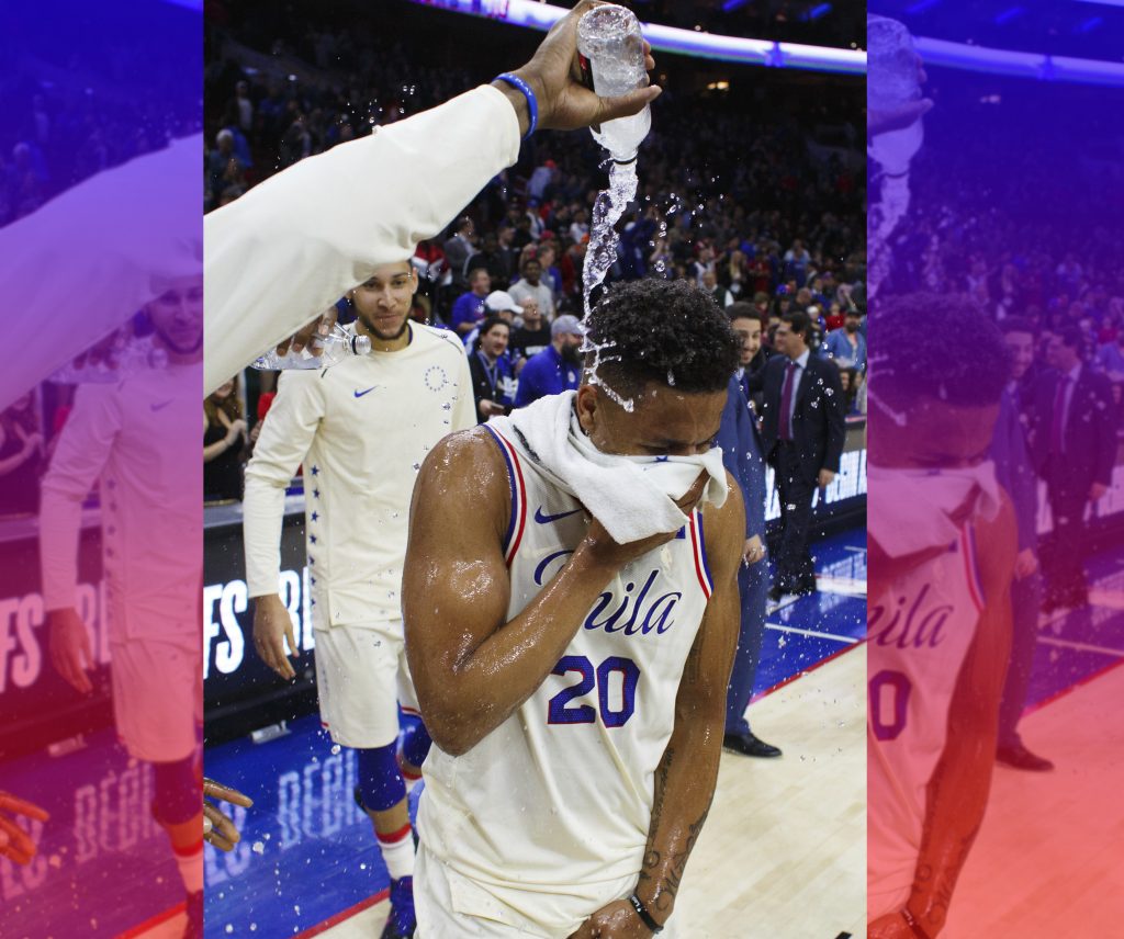 Philadelphia 76ers' Markelle Fultz gets doused by water after the team's NBA basketball game against the Milwaukee Bucks, Wednesday, April 11, 2018, in Philadelphia. The 76ers won 130-95.