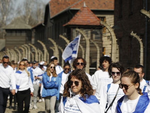 A group of Israeli youth visit the former Nazi German death camp of Auschwitz ahead of the yearly March of the Living, a Holocaust remembrance march, in Oswiecim, Poland, on April 12, 2018. (Czarek Sokolowski/AP Photo)