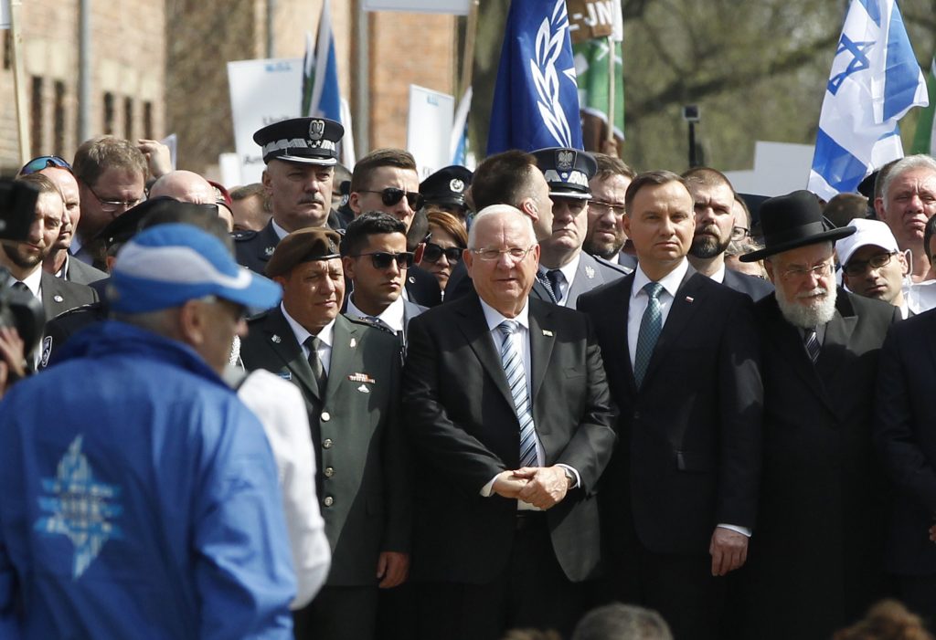 Andrzej Duda, Reuven Rivlin Poland's President Andrzej Duda, (center right), and Israel's President Reuven Rivlin, (center left), walk in the March of the Living, a yearly Holocaust remembrance march between the former Nazi German death camps of Auschwitz and Birkenau, in Oswiecim, Poland, on Thursday, April 12, 2018. (Czarek Sokolowski/AP Photo)