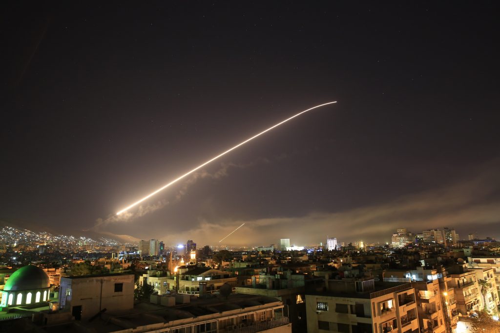 APTOPIX Syria US The Damascus sky lights up missile fire as the U.S. launches an attack on Syria targeting different parts of the capital early Saturday, April 14, 2018. Syria's capital has been rocked by loud explosions that lit up the sky with heavy smoke as U.S. President Donald Trump announced airstrikes in retaliation for the country's alleged use of chemical weapons. (Hassan Ammar/AP Photo)