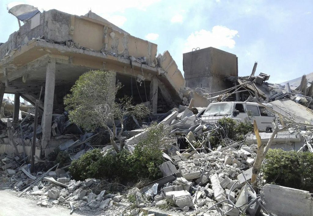 Syria US In this photo released by the Syrian official news agency SANA, shows the damage of the Syrian Scientific Research Center which was attacked by U.S., British and French military strikes to punish President Bashar Assad for suspected chemical attack against civilians, in Barzeh, near Damascus, Syria, Saturday, April 14, 2018. A Syrian military statement said in all, 110 missiles were fired by the U.S., Britain and France and that most of them were shot down or derailed. Russia's military said Syrian air defense units downed 71 out of 103 cruise missiles launched by the U.S. and its allies. (SANA via AP)