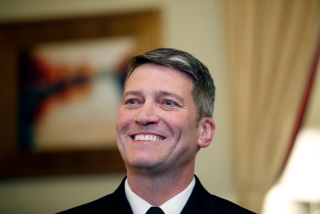 AP_18106755439421 U.S. Navy Rear Admiral Ronny Jackson, M.D., sits with Sen. Johnny Isakson, R-Ga., chairman of the Veteran's Affairs Committee, before their meeting on Capitol Hill, Monday, April 16, 2018 in Washington.
