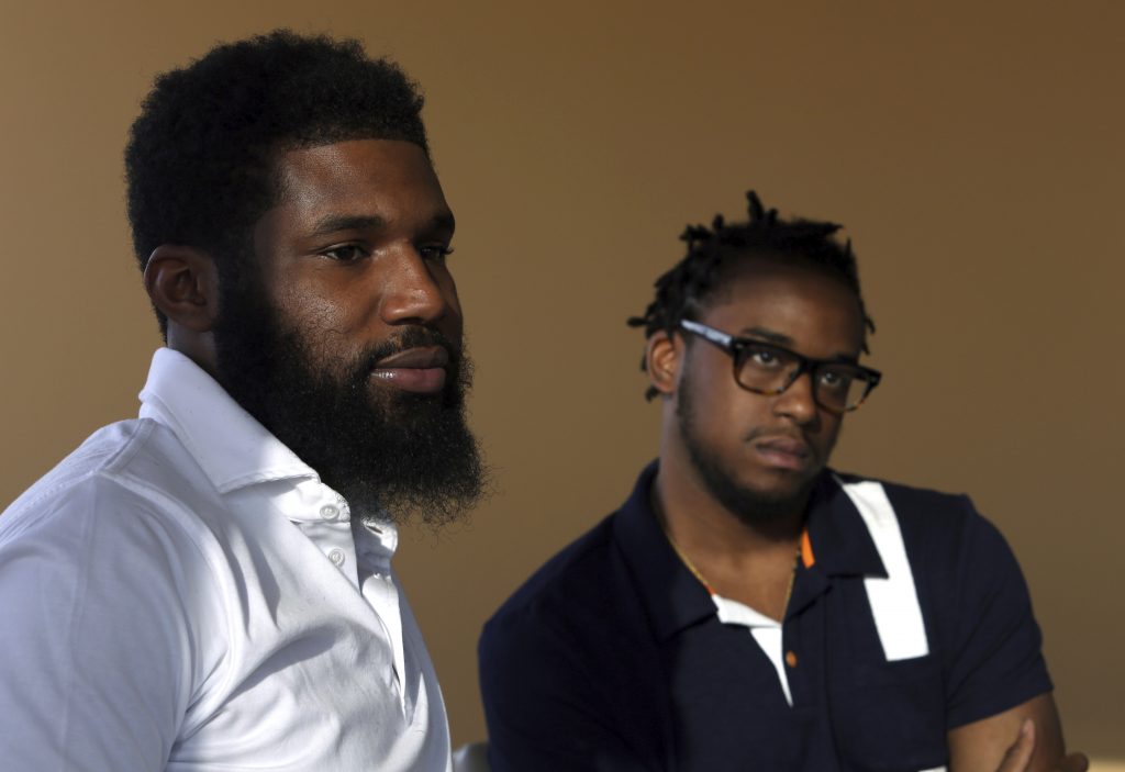 Starbucks Black Men Arrested In this Wednesday, April 18, 2018 photo, Rashon Nelson, (left), and Donte Robinson, (right), listen to a reporter's question during an interview with The Associated Press in Philadelphia. Their arrests at a local Starbucks quickly became a viral video and galvanized people around the country who saw the incident as modern-day racism. In the week since, Nelson and Robinson have met with Starbucks CEO Kevin Johnson and are pushing for lasting changes to ensure that what happened to them doesn't happen to future patrons. (Jacqueline Larma/AP Photo)