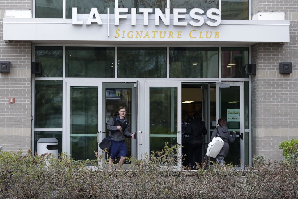 LA Fitness Black Customer A person leaves an LA Fitness gym while a group of women enter the club, Thursday, April 19, 2018, in Secaucus, N.J. Employees of the LA Fitness wrongly accused a black member and his guest of not paying to work out and called police, prompting an apology from the company. (Julio Cortez/AP Photo)