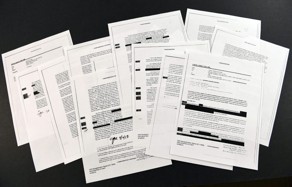 Comey memos Copies of the memos written by former FBI Director James Comey are photographed in Washington, Thursday, April 19, 2018. President Donald Trump told former FBI Director James Comey that he had serious concerns about the judgment of his first national security adviser, Michael Flynn, according to memos maintained by Comey and obtained by The Associated Press. The 15 pages of documents contain new details about a series of interactions that Comey had with Trump in the weeks before his May 2017 firing. Those encounters include a White House dinner at which Comey says Trump asked him for his loyalty. (Susan Walsh/AP Photo)