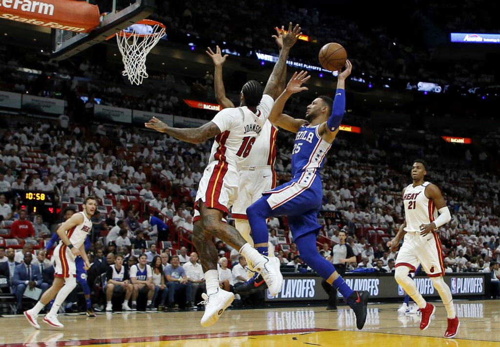 76ers Heat Basketball Philadelphia 76ers guard Ben Simmons (25) shoots in the first quarter as Miami Heat forward James Johnson (16) defends in Game 4 of a first-round NBA basketball playoff series, Saturday, April 21, 2018, in Miami. (AP Photo/Joe Skipper)