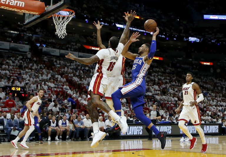 Philadelphia 76ers guard Ben Simmons (25) shoots in the first quarter as Miami Heat forward James Johnson (16) defends in Game 4 of a first-round NBA basketball playoff series, Saturday, April 21, 2018, in Miami. (AP Photo/Joe Skipper)