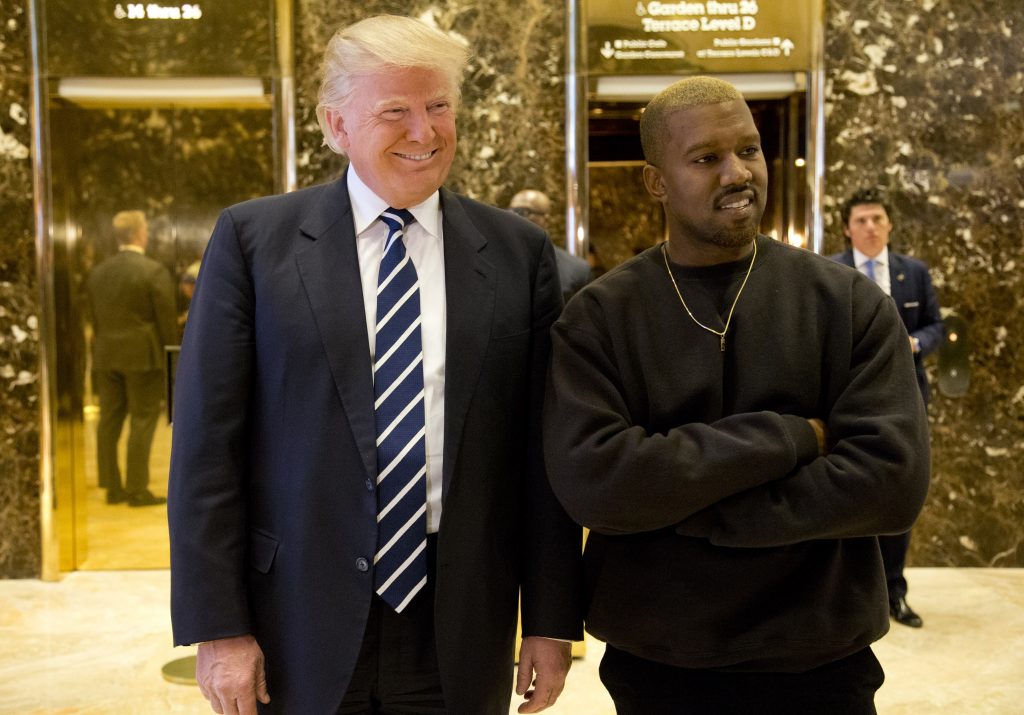 Donald Trump, Kanye West President-elect Donald Trump, left, and Kanye West pose for a picture in the lobby of Trump Tower in New York in 2016. (AP Photo/Seth Wenig)
