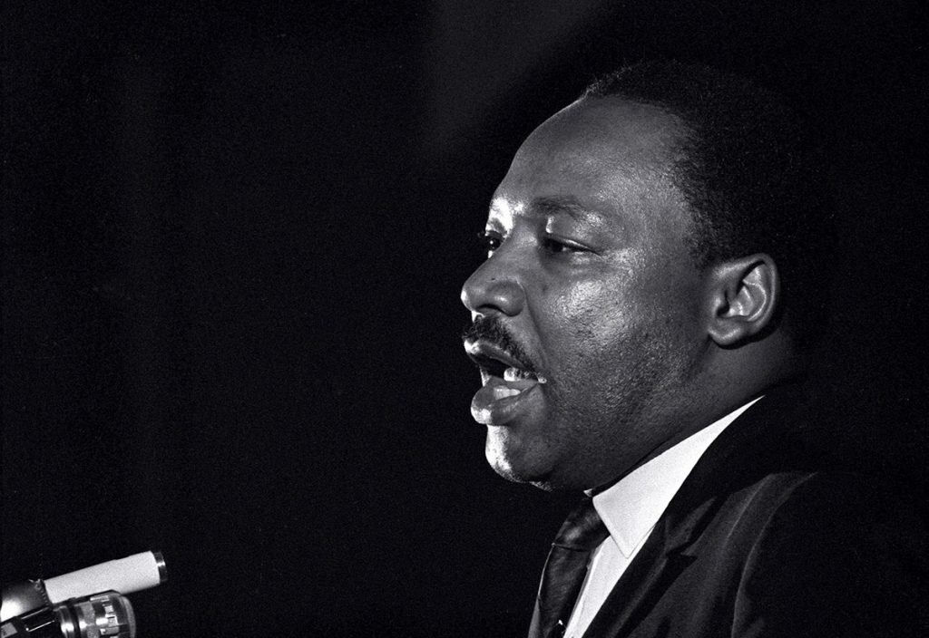 MARTIN LUTHER KING JR. In this April 3, 1968 file photo, Dr. Martin Luther King Jr. makes his last public appearance at the Mason Temple in Memphis, Tenn. The following day King was assassinated on his motel balcony. (Charles Kelly/AP Photo, File)