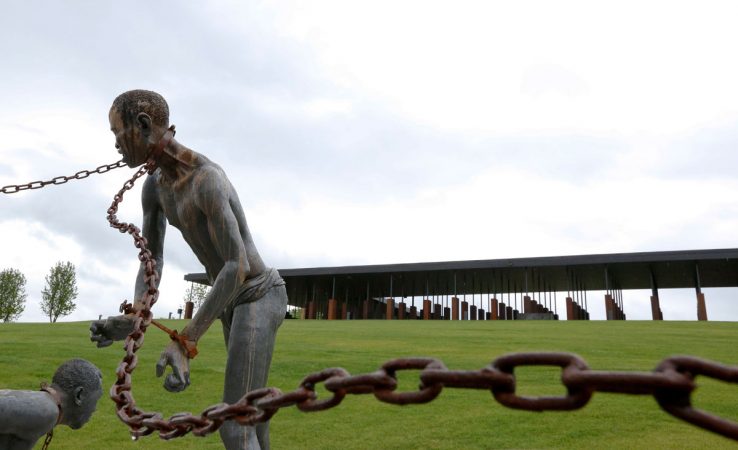 A statue of a of a chained man is on display at the National Memorial for Peace and Justice, the new memorial is opening to honor thousands of people killed in racist lynchings on Sunday, April 22, 2018, in Montgomery, Ala. The Memorial and Justice and the Legacy Museum will open on Thursday. (Brynn Anderson/AP Photo)
