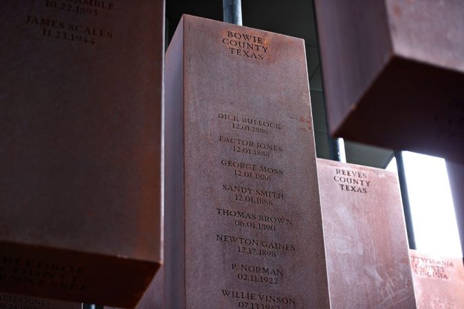 This photo shows part of the display at the National Memorial for Peace and Justice, a new memorial to honor thousands of people killed in racist lynchings, Monday, April 23, 2018, in Montgomery, Ala. The national memorial aims to teach about America's past in hope of promoting understanding and healing. It's scheduled to open on Thursday. (Brynn Anderson/AP Photo)