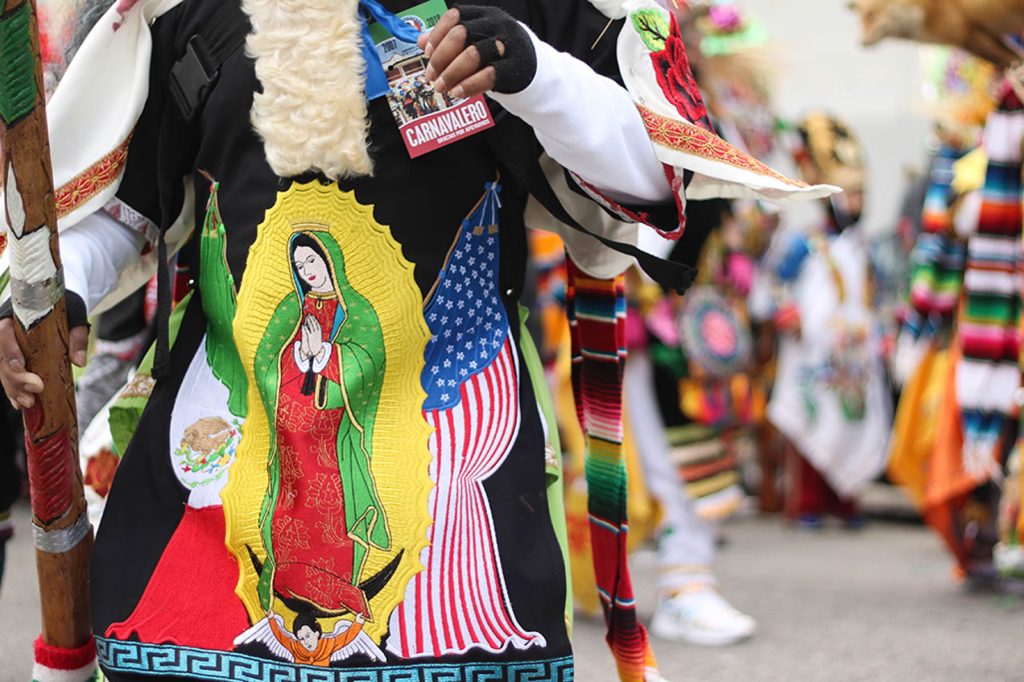 Carnaval_7 The Virgin of Guadalupe, an iconic image in Mexican culture, adorns the costumes of carnavaleros, the performers in the yearly festival, Carnaval de Puebla.