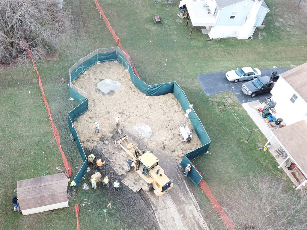 DCIM100MEDIADJI_0116.JPG Crews work to stabilize sinkholes in a West Whiteland Township neighborhood on March 3. The sinkholes appeared recently near a construction site for the Mariner East 2 pipeline. The PUC ordered Sunoco to shut down nearby Mariner East 1 until it can prove the line is safe to operate amid the sinkholes and geology of the region. (Eric Friedman)